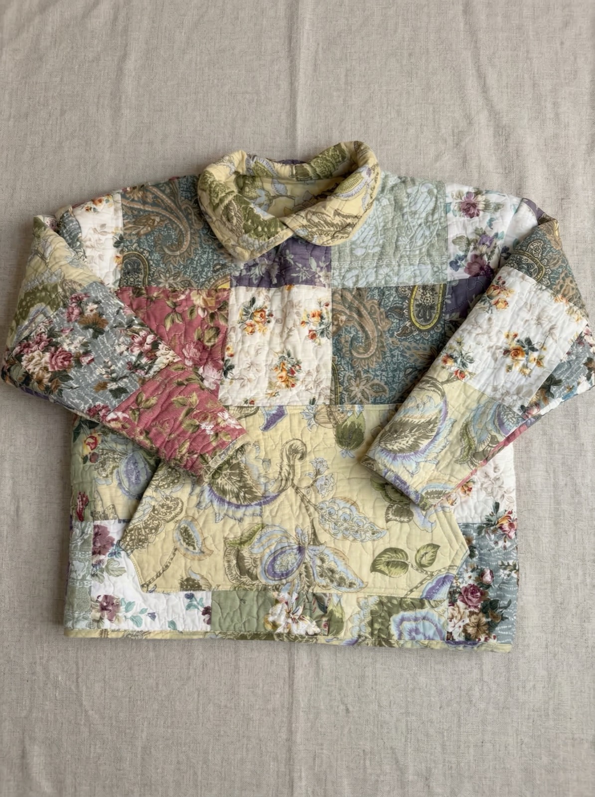 Patchwork quilted sweatshirt with mixed floral and paisley fabric patches